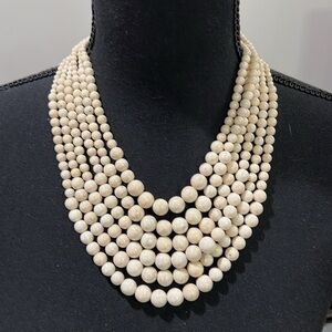 Gorgeous multi strand ivory marble necklace.
